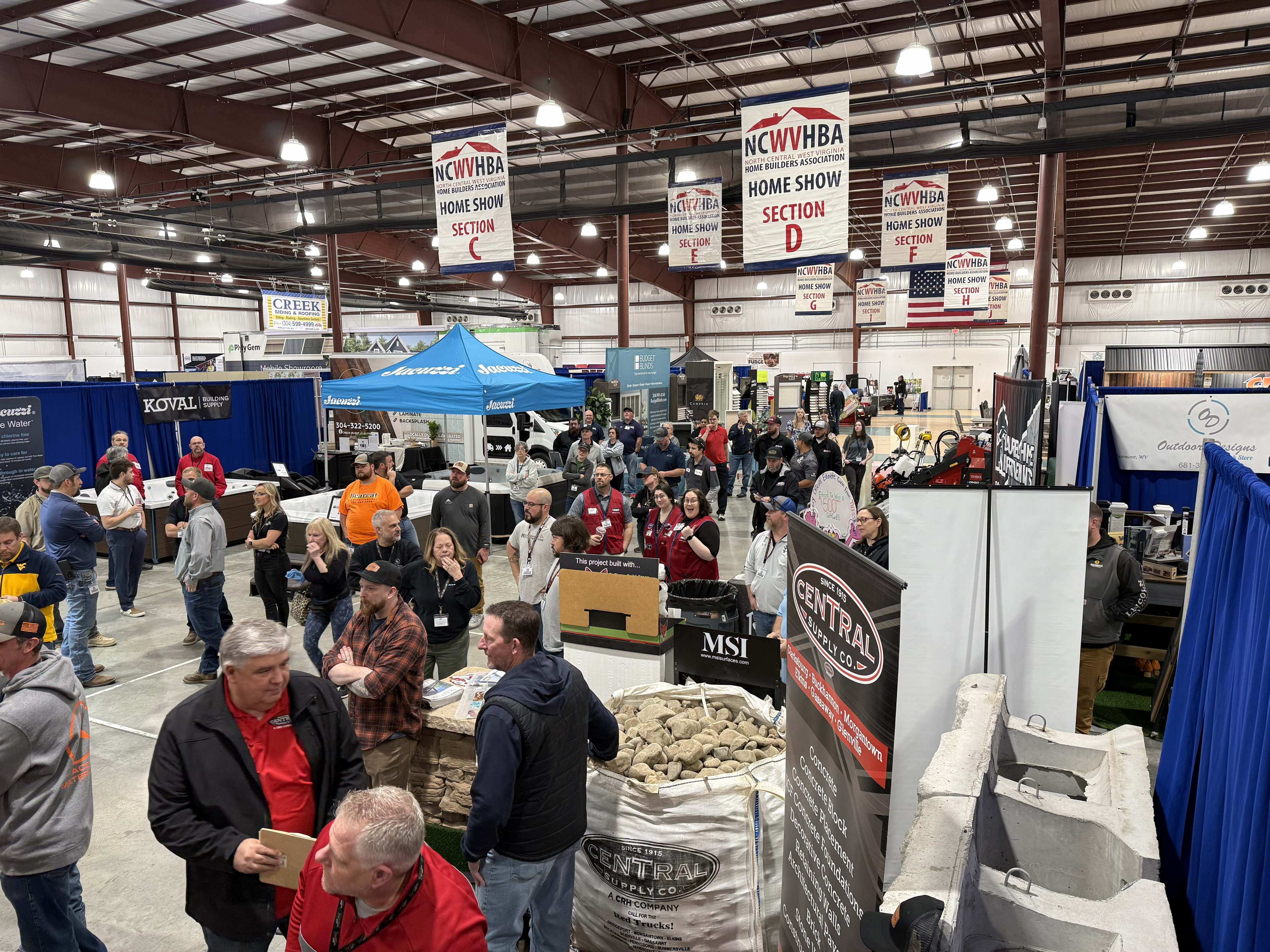 Overhead view of the NCWVHBA Home Show floor, with exhibitors, attendees, and section banners throughout the hall.
