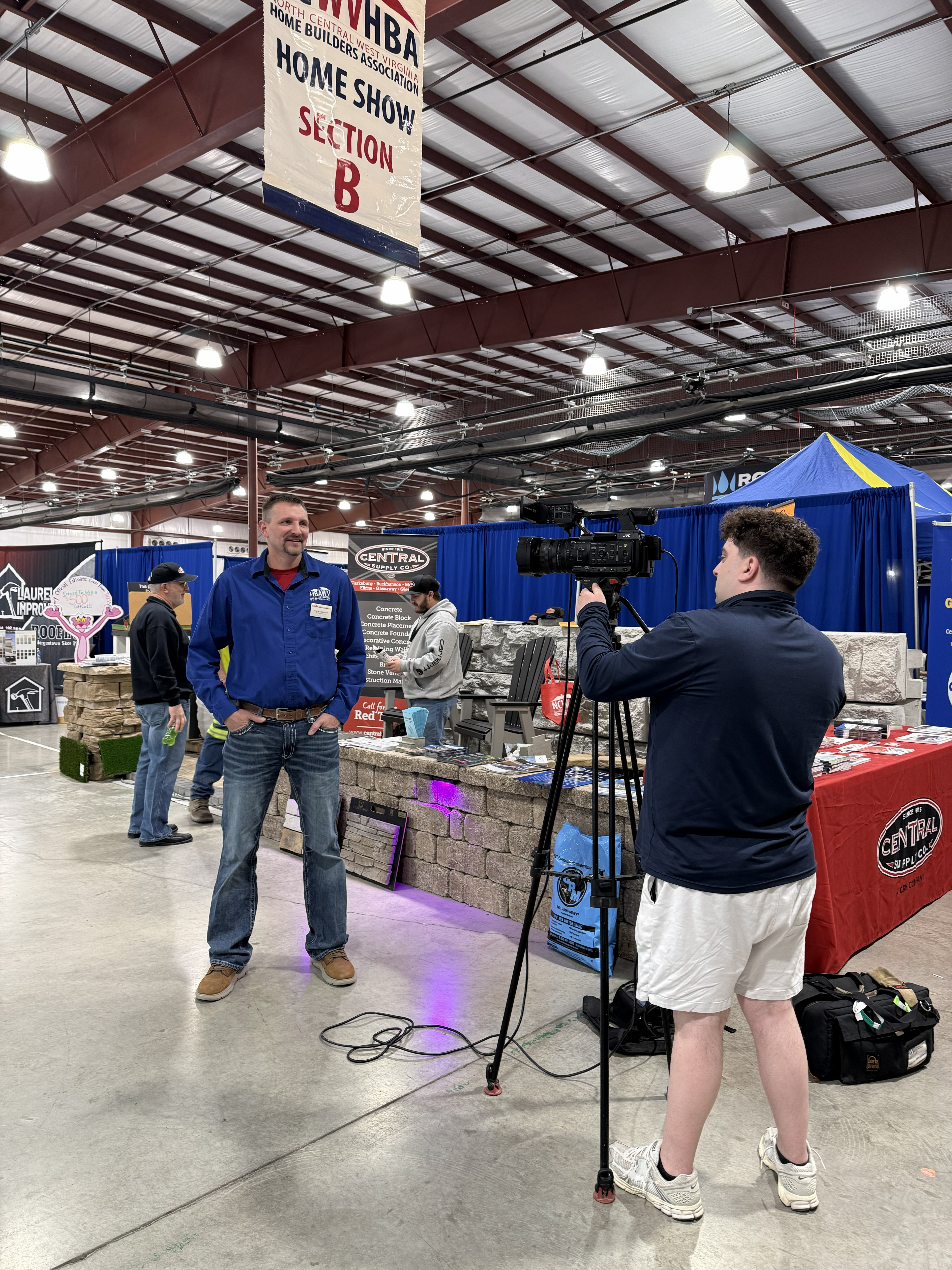 A Home Show exhibitor being interviewed on camera beneath an NCWVHBA Home Show banner.